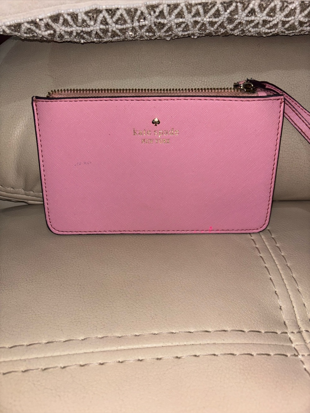 kate spade pink leather wristlet clutch with gold logo